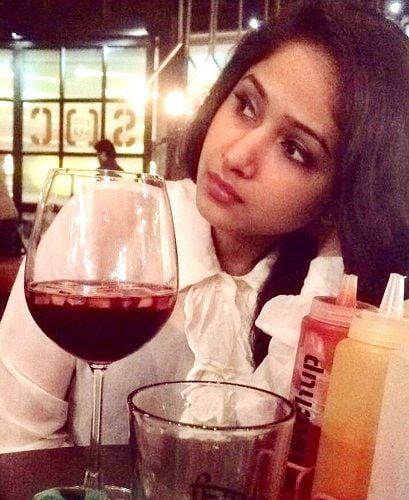 Pranali Ghoghare with a glass of wine