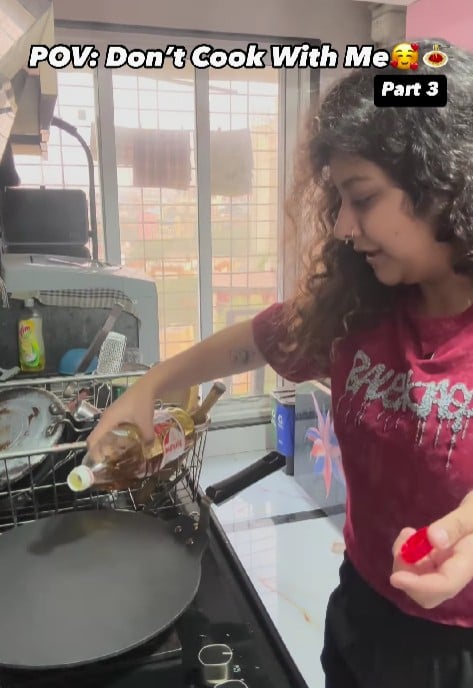 Pranjali Papnai while trying to cook a dish in one of her videos