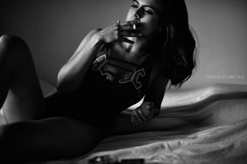 Prashansa Sharma smoking a cigarette