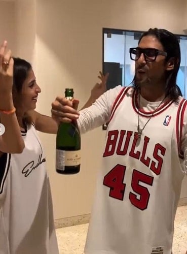 Prateik Babbar holding a bottle of champagne