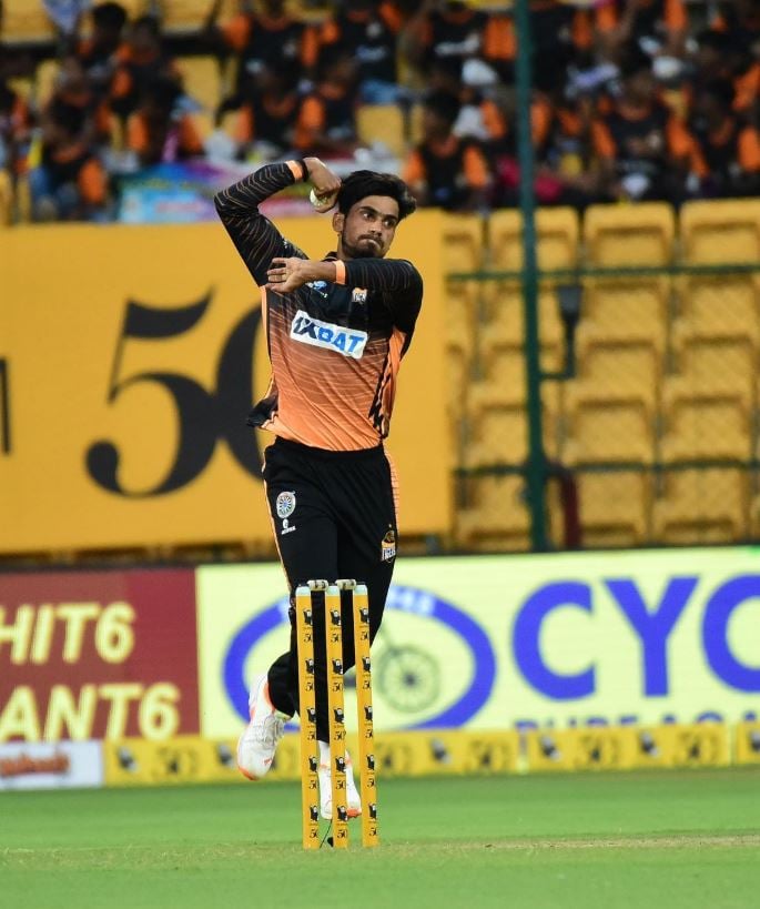 Pravin Dubey bowling during a cricket match for Hubli Tigers
