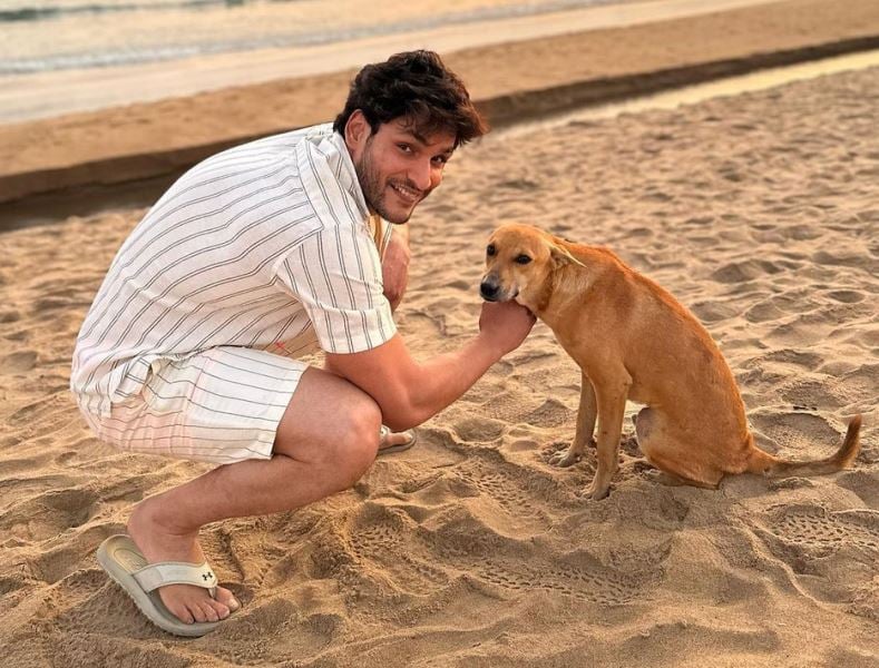 Prem Parija patting a dog