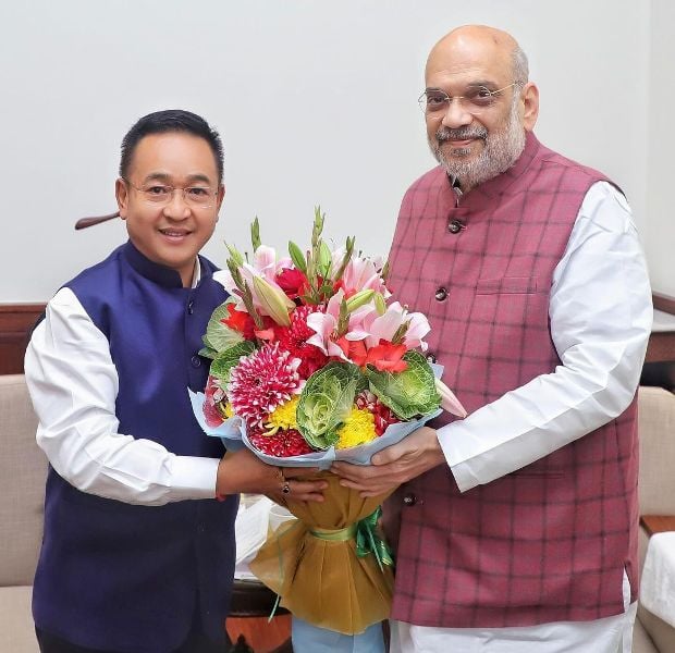 Prem Singh Tamang with Amit Shah (right) during a NDA meeting