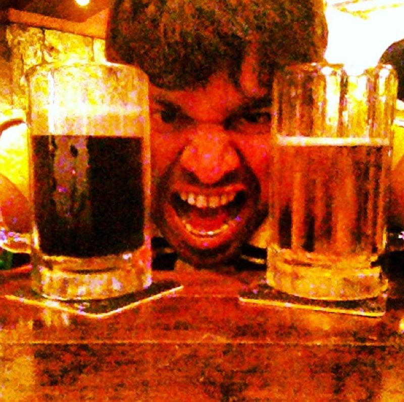 Premgi Amaren drinking beer