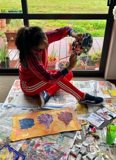 Premila Morar painting a picture