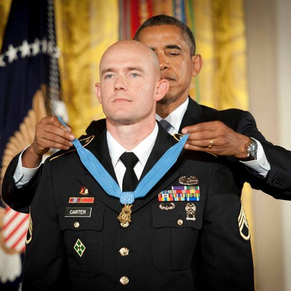President Barack Obama placed the Medal of Honor around Carter