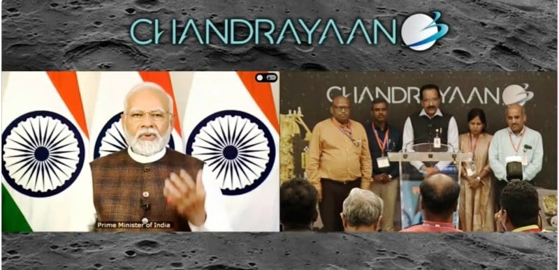 Prime Minister Narendra Modi addressing the team of ISRO scientists involved in the landing of Chandrayaan-3 with Veeramuthuvel in the background (second from left)