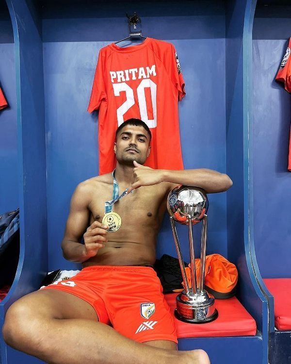Pritam Kotal posing with the SAFF Trophy