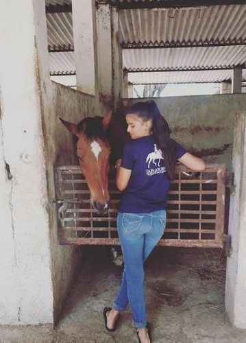 Pritha Bakshi with a horse