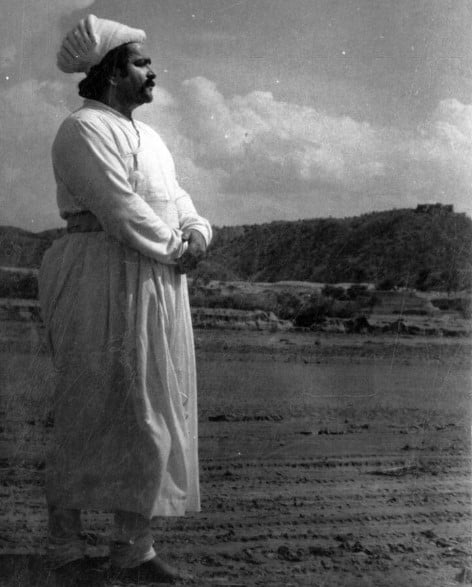 Prithviraj Kapoor in a still from the film Mughal-e-Azam while shooting barefoot in desert