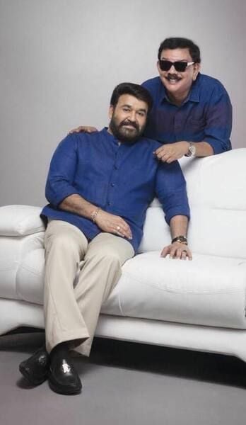 Priyadarshan (standing) with his friend and Indian actor Mohanlal
