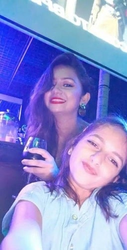 Priyanka Halder holding a glass of wine