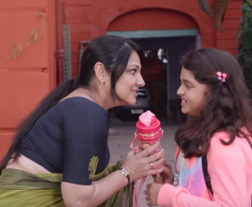 Priyanka Upendra in a still from the film Devaki with her daughter Aishwarya