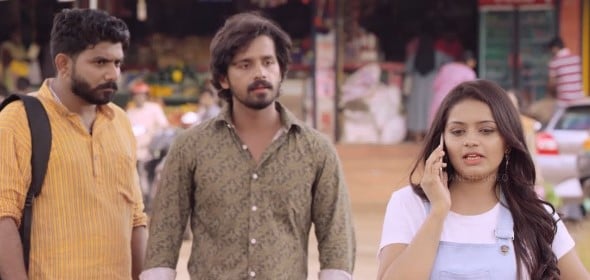 Pruthvi Ambaar (middle) in a still from the Kannada film DK Boss (2019)