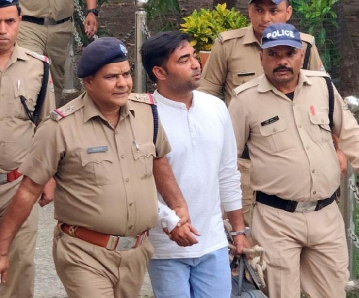 Pulkit Arya being taken out of court after life imprisonment sentence