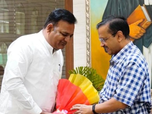 Raaj Kumar Anand with Arvind Kejriwal
