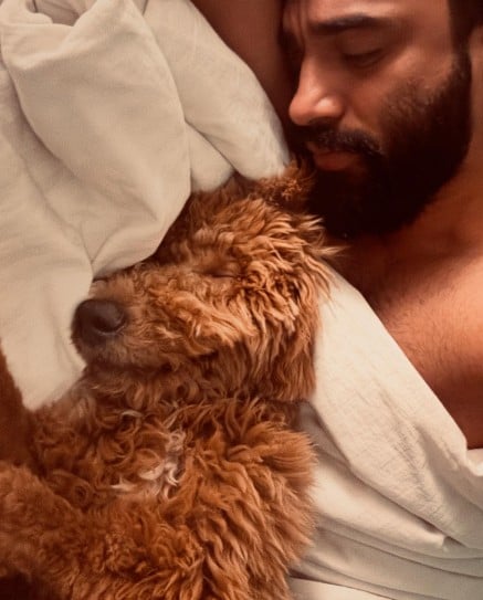 Rachit Singh posing with his pet dog