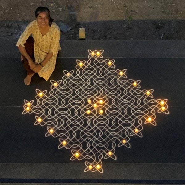 Radha Vembu making Kolam rangoli