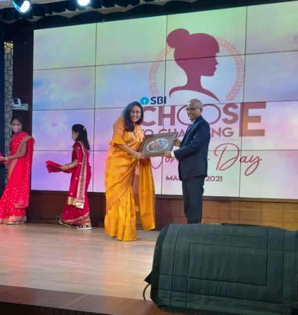 Radhika Gupta being honoured by SBI