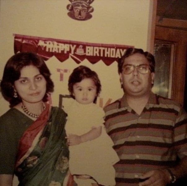 Radhika Gupta with her parents as a child