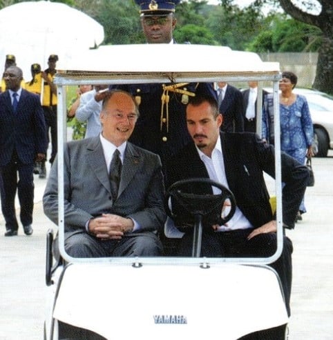 Rahim Al-Hussaini with his father while touring Filtisac, an enterprise in Abidjan, Ivory Coast