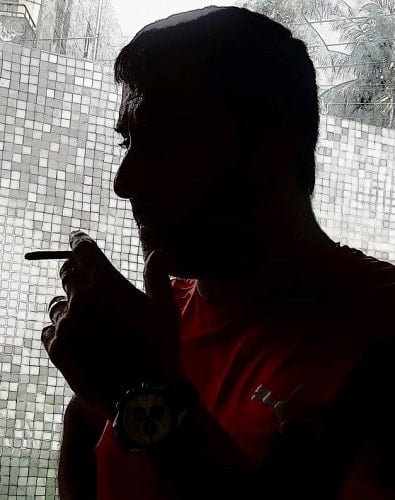 Raj Deepak Shetty smoking a cigarette