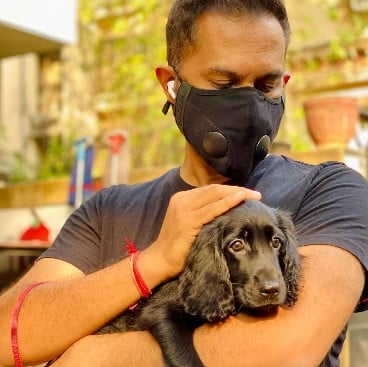 Raj Nidimoru with his pet dog