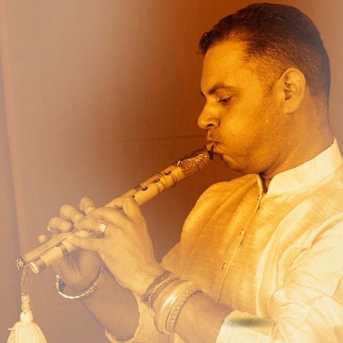 Rajan Nalagarh playing flute