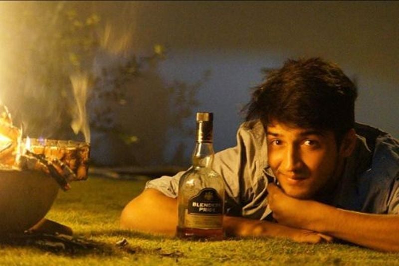Rajat Verma Holding A Bottle Of Alcohol
