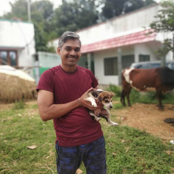 Ramachandran Ramesh with a dog