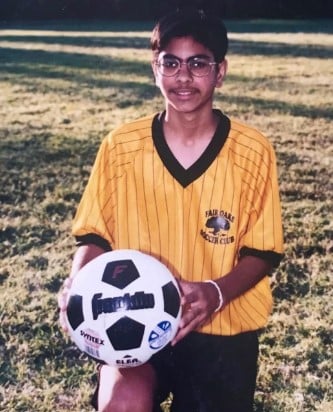 Ramit Sethi posing with a soccer ball