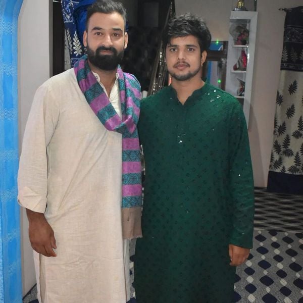 Rasikh Salam with his cousin Nadeem Dar
