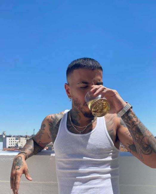 Rauw Alejandro drinking alcohol