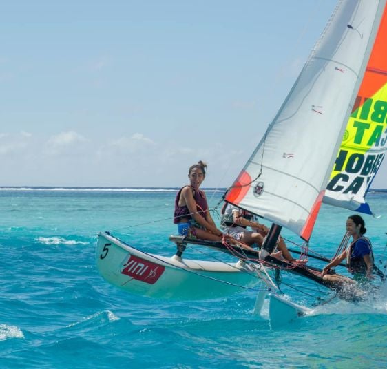 Ravahere Silloux sailing on the sea with her friends
