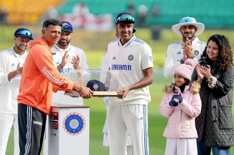 Ravichandran Ashwin while receiving the special Test cap from Rahul Dravid