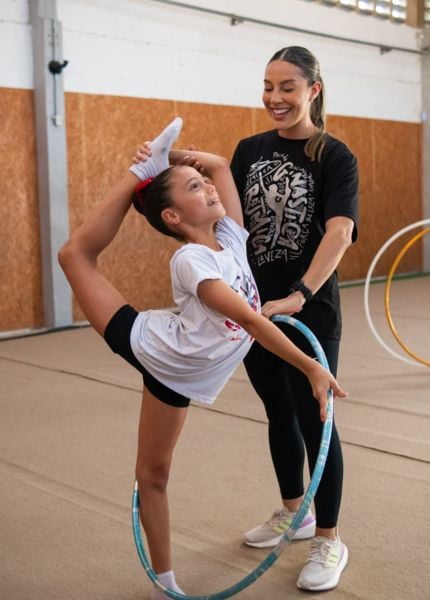 Renata Saldanha teaching one of her students at the rhythmic gymnastics school