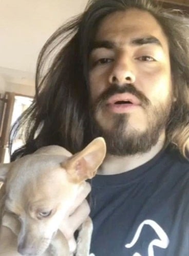 Rey Grupero with his adopted dog
