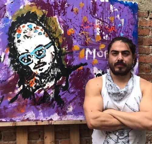 Rey Grupero with his painting