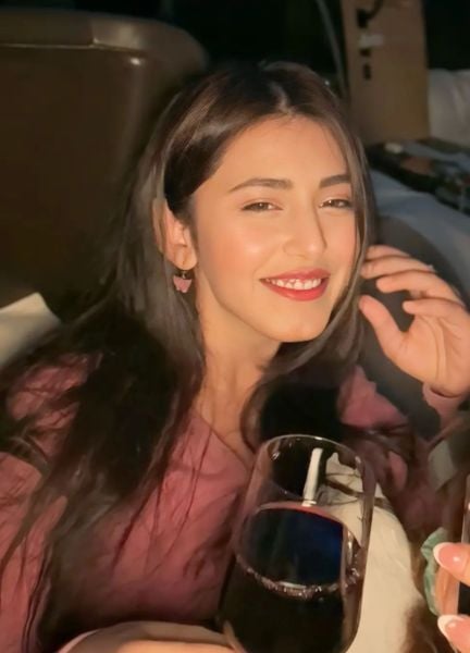 Richa Mukherjee drinking wine