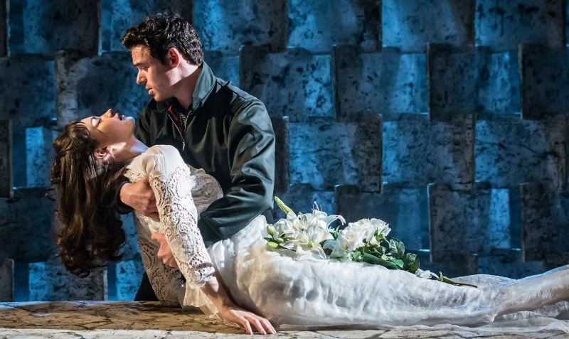 Richard Madden (as Romeo), along with Lily James (as Juliet), in the play 