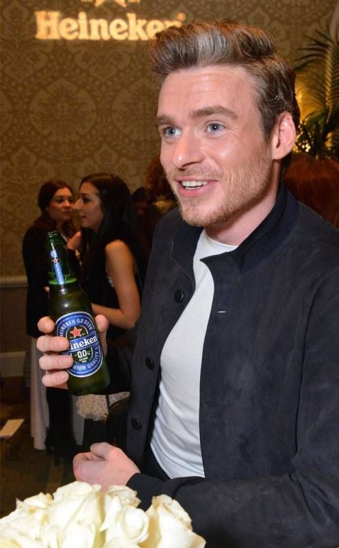 Richard Madden while having a beer