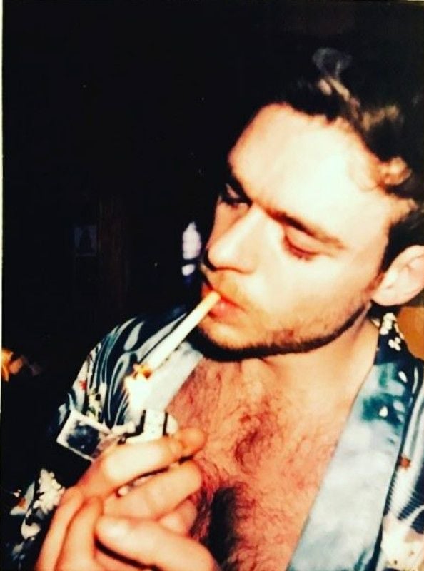 Richard Madden while smoking a cigarette