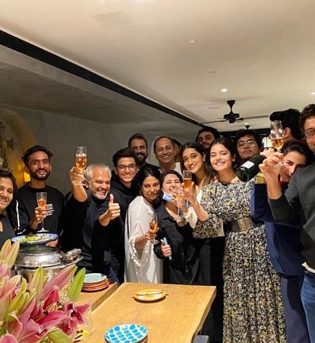 Riddhi Kumar holding a glass of alcohol