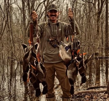 Riley Green with the hunted waterfowl
