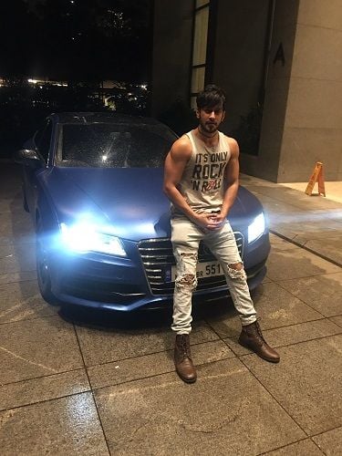 Rishabh Sinha with his car