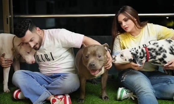 Rishabh Tondon with his wife and their pet dogs