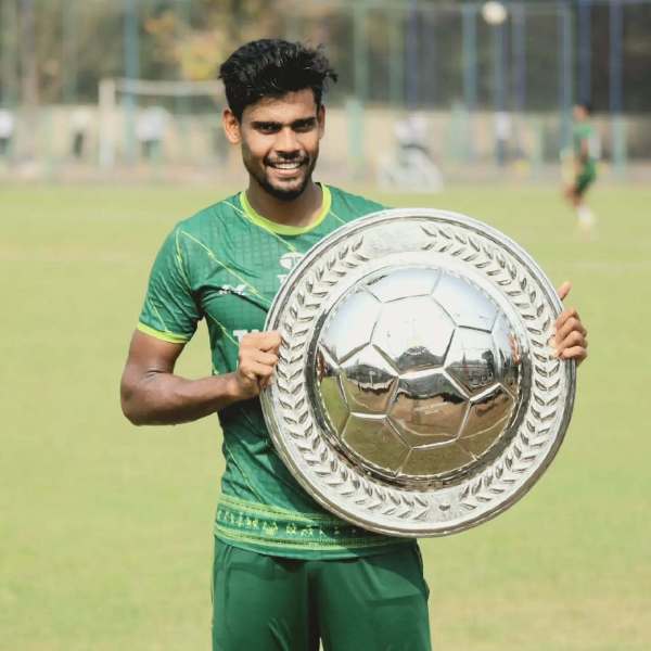Ritwik Das posing with the Indian Super League League Winners Shield