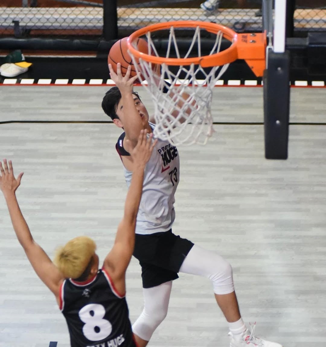 River Joseph playing basketball