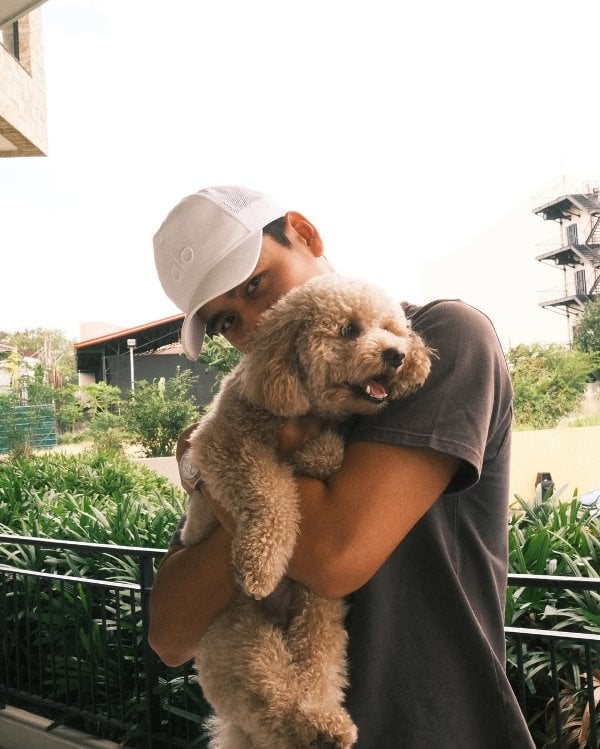 River Joseph with his pet dog