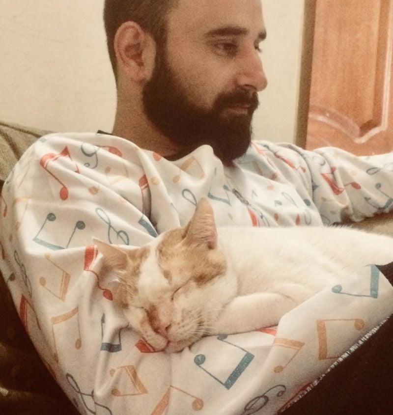 Rockey Raina with his cat